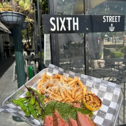 dish of food next to a street sign