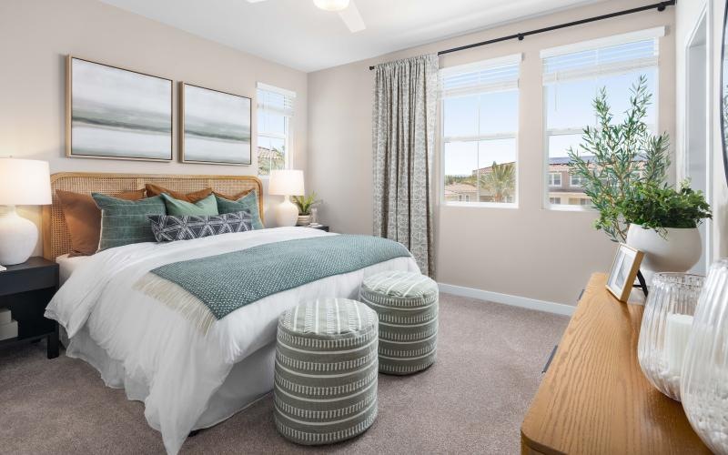 a bedroom with a bed and a table