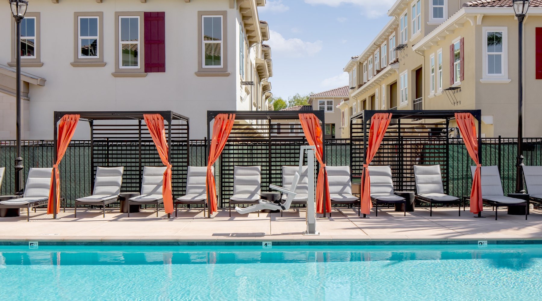 a pool with chairs around it
