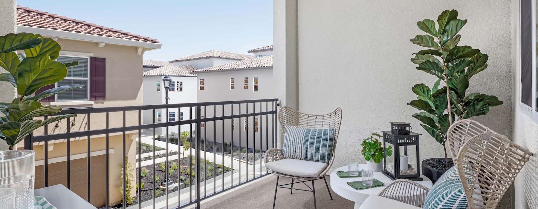 a patio with a table and chairs